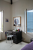 Old desk and chair in corner of the bedroom