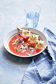Tomato soup with asparagus ravioli