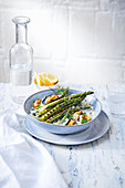 Rice bowl with grilled mussels and green asparagus