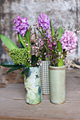 Vases of hyacinths, skimmia, waxflowers and broom