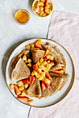 Cinnamon crepes with caramelized apples and strawberries