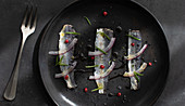 Marinated sardines fish fillet with onion and herbs