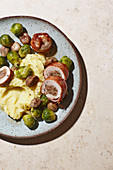 Stuffed pork roulade with Brussels sprouts and mashed potatoes