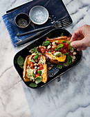Gratinated sweet potatoes with blue cheese and nuts