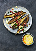 Aubergines with saffron yoghurt and pomegranate seeds