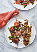 Turkey lamb skewers with a tomato and mint salad