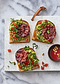 Turkish-style toast topped with avocao and pastirma