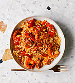 Paella with chorizo, grilled peppers and prawns