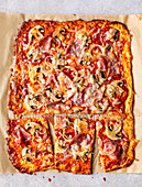 A low-carb ham and mushroom pizza