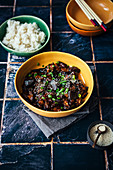 Gochujang glazed aubergine with steamed rice and sesame seeds