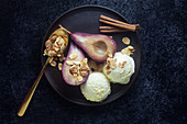 Red wine pears with vanilla ice cream and roasted almonds