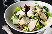 Caesar salad with chicken and vegetables