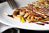 Crepe filled with tonkatsu and seafood