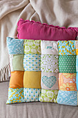 Handmade patchwork cushion in pastel shades