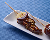 Chocolate fondue with banana and nut brittle