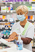 Pharmacist using hydroalcoholic gel