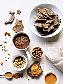 Gluten free flax seed cracker with almond butter, nuts and seeds