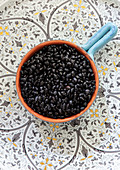 Black beans in a ceramic pot