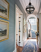 Elegant hallway in classic period building with pale blue walls