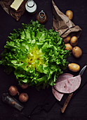Smooth endive salad, potatoes, ham, onions, oil and nutmeg