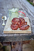 Grilled venison steaks with an avocado and cream cheese dip