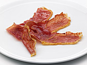 Slices of dried ham on a plate