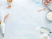 A frame of baking utensils and dough ingredients