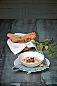 Cold almond soup with sous-vide wild pork cheeks and braised garlic