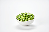 Fresh soya beans in a white bowl