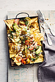 Nachos with goat's cheese, avocado, jalapenos, tomatoes, coriander and peanuts