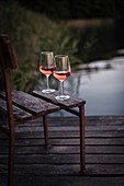 Glass of rose by the lake