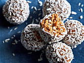 Carrot cake energy balls covered with grated coconut