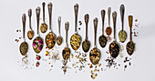 Assortment of dry tea in vintage spoons