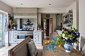 Kitchen with bespoke Shaker-style units, intricate wooden hand-carving above the Britannia range