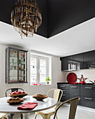 Round table in modern kitchen decorated in grey and white