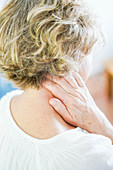 Woman suffering from neck pain