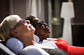 Serene senior women friends sunbathing