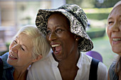 Happy senior women friends laughing