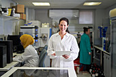 Female scientist with digital tablet in laboratory