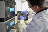 Male scientist using equipment in laboratory