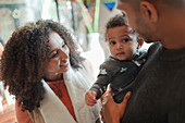 Happy parents with baby daughter