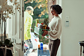 Woman receiving grocery delivery