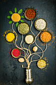 Various bowls of spices on dark background