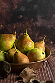 Fresh pears in a copper baking pan