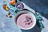 Purple cauliflower soup in bowl