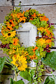 Autumn wreath made of marigold flowers and fennel umbels