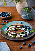 Chocolate pancakes with mascarpone and berries