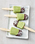 Avocado popsicles with coconut-chocolate icing