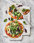 Gluten-free pizza with wild herbs and goat gouda