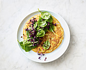 Potato omelette with turmeric, spinach and red cress